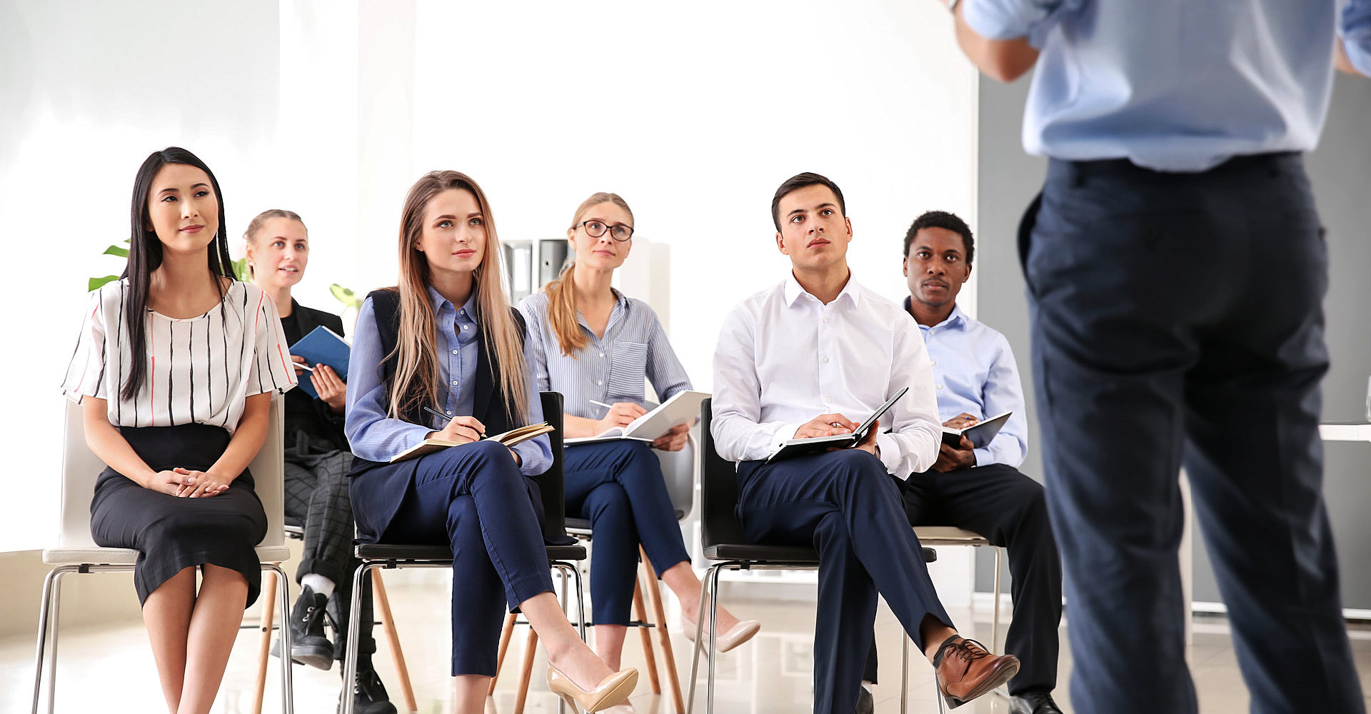group of people listening to the person infront