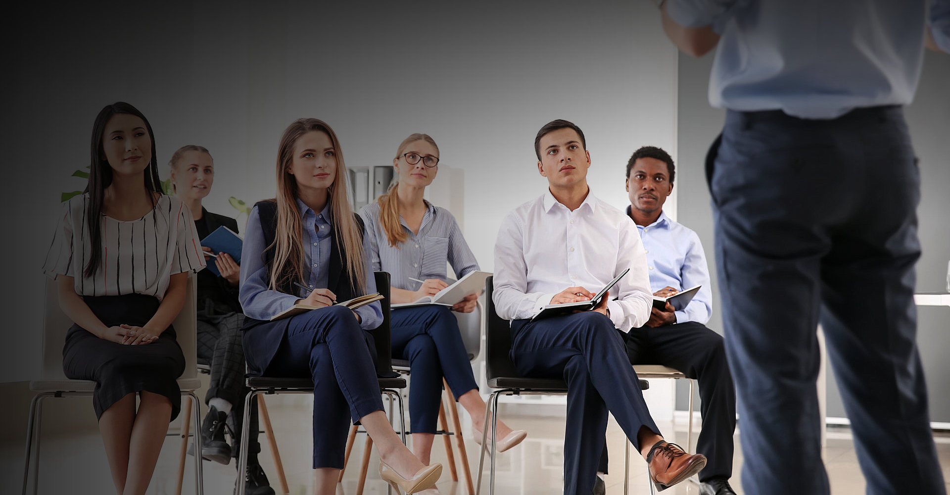 group of people listening to the person infront