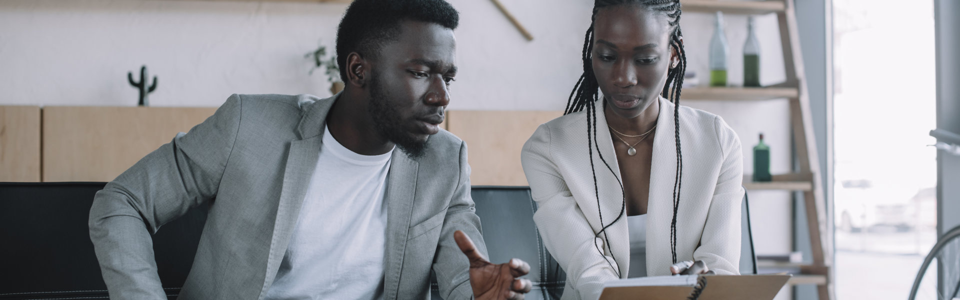 woman and man looking at the notes