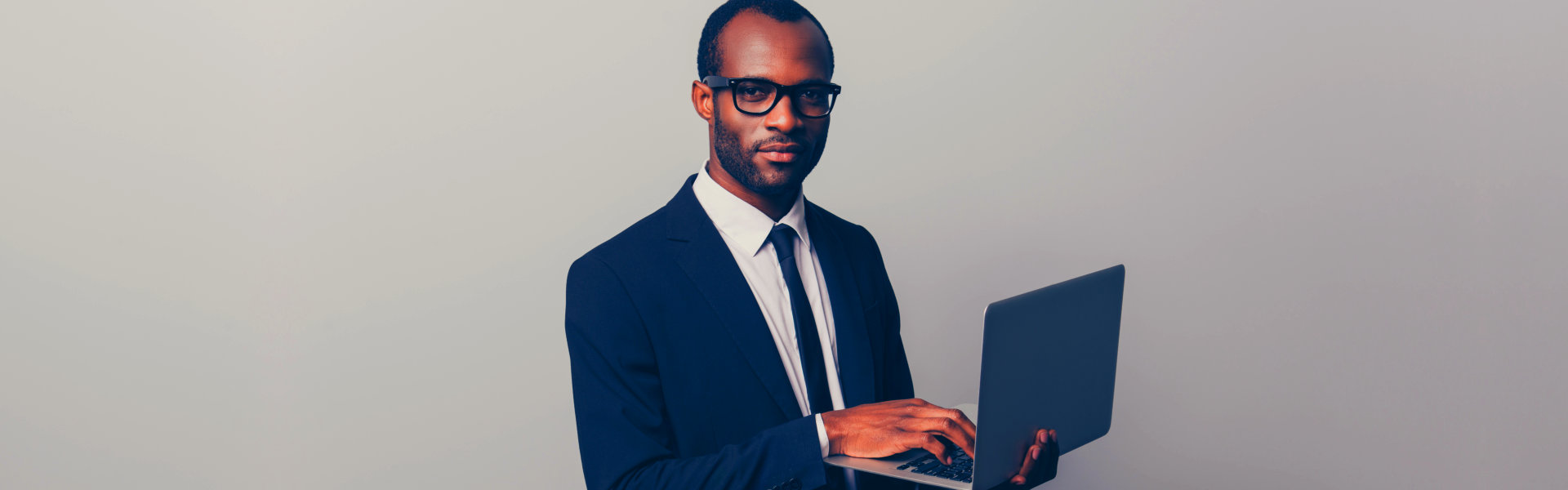 man holding a laptop